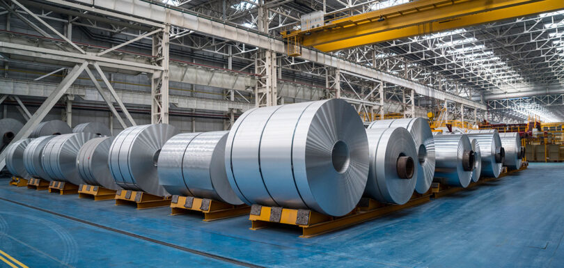 large rolls of metal in a warehouse