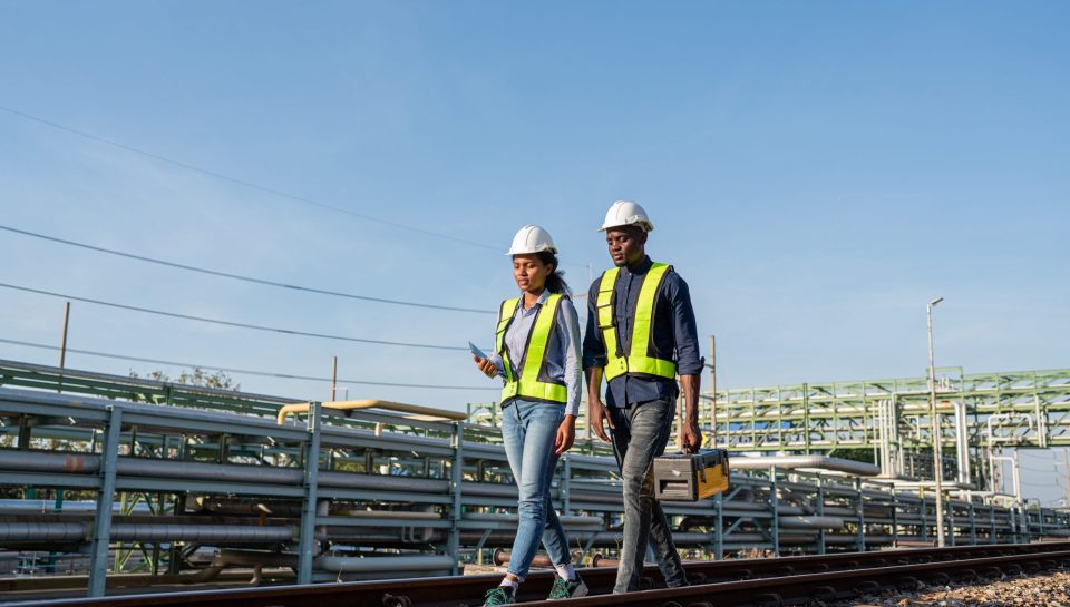 Engineer wearing safety uniform sitting on railway inspection. construction worker on railways. Engineer work on Railway. Rail, engineer, Infrastructure.