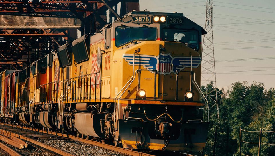 3_UP train on industrial bridge pexels-vitaliy-haiduk-326720599-32058302